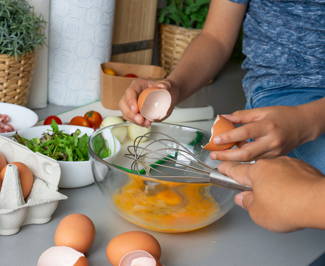 preparing a meal of eggs